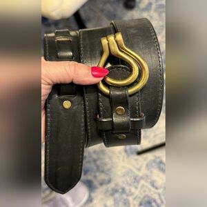 Leather belt with a brass-tone, Omega-shaped buckle. BLACK UNISEX